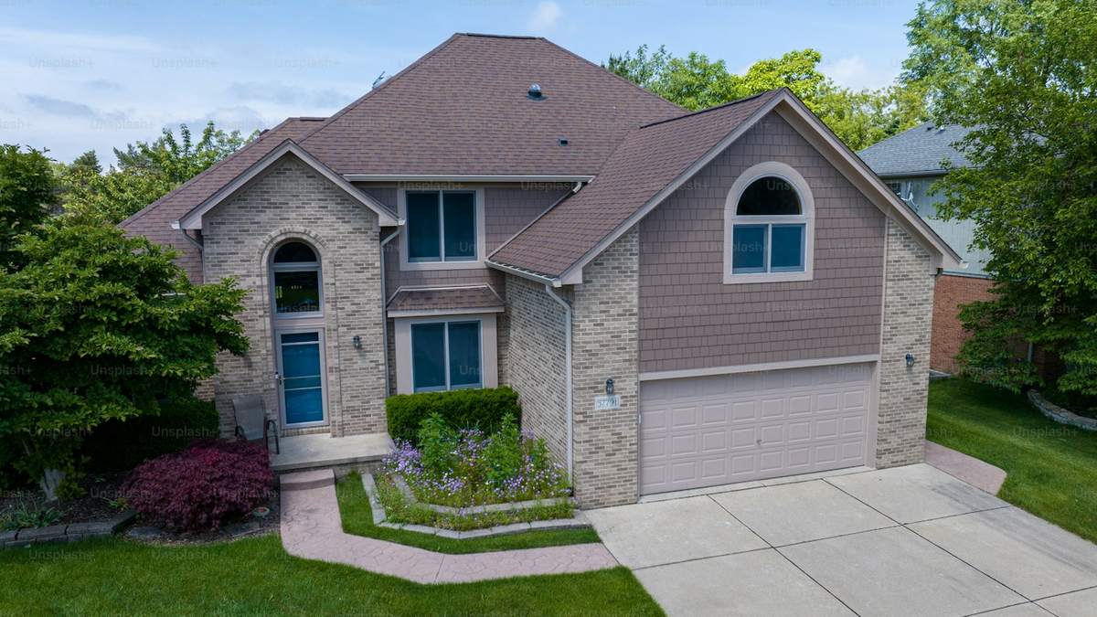 Two-storey single-family investment property with an attached garage