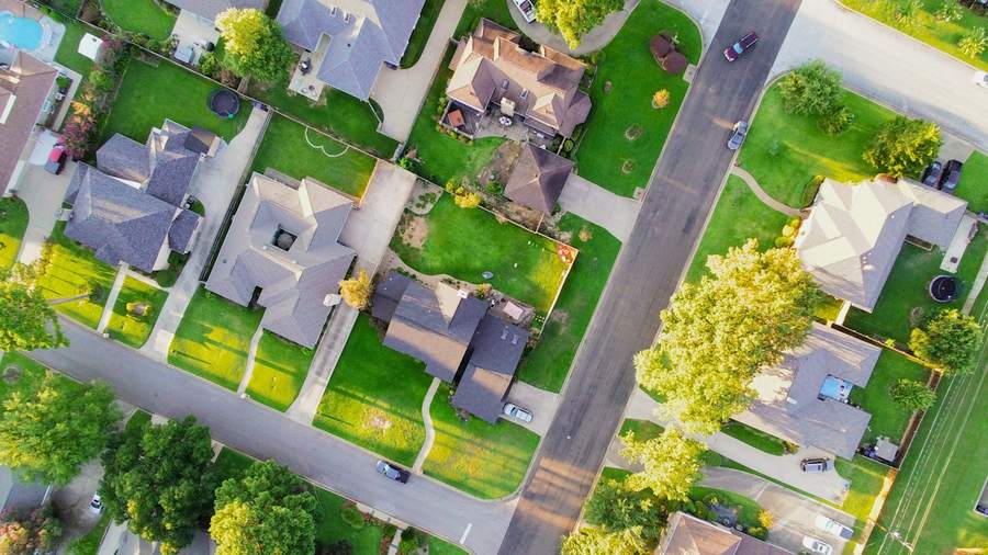 Overhead view of single-family rental homes in a suburban street grid